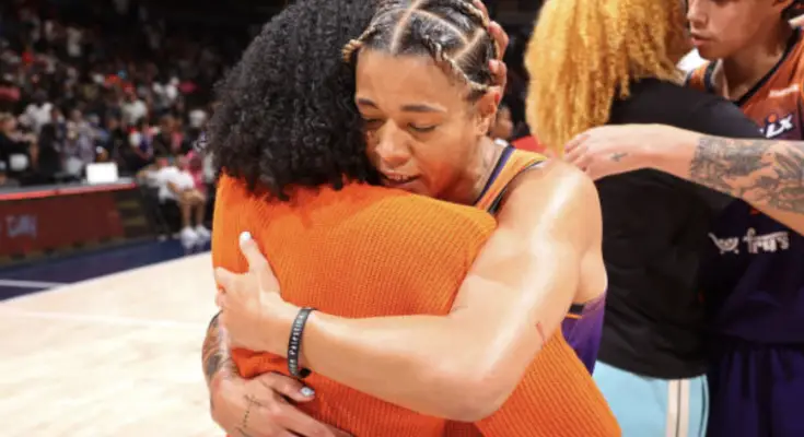 Mercury guard Natasha Cloud embraces Mystics guard Brittney Sykes